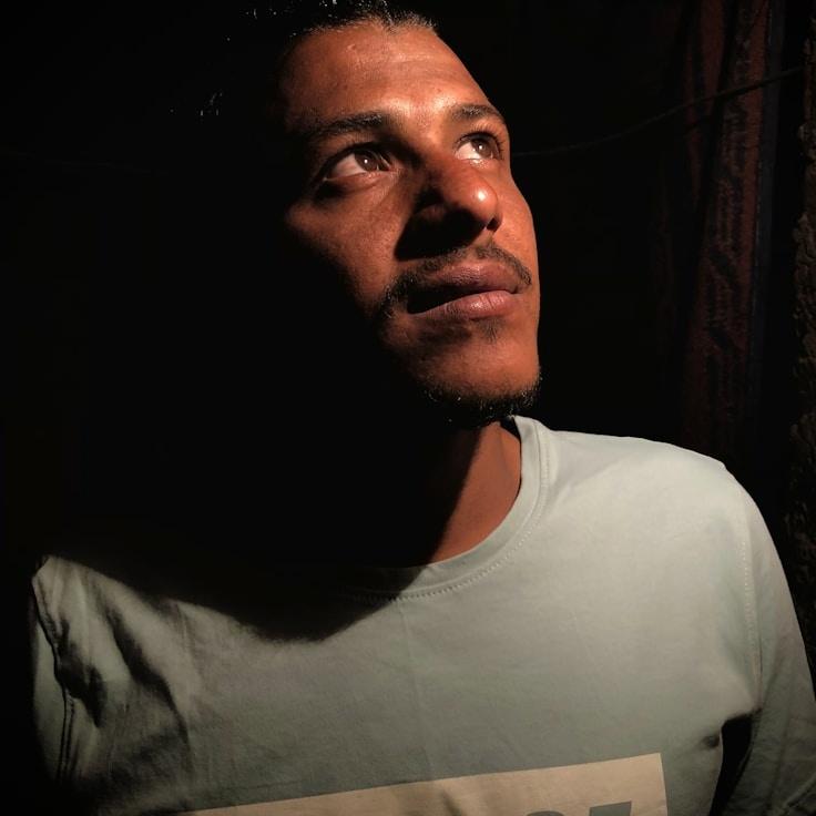 Avery Singh, Lead Design Curator at Distributed Logic Center, reviewing corporate floral arrangements